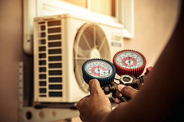 Professional Heat Pump Repair technician working in Georgetown, IN